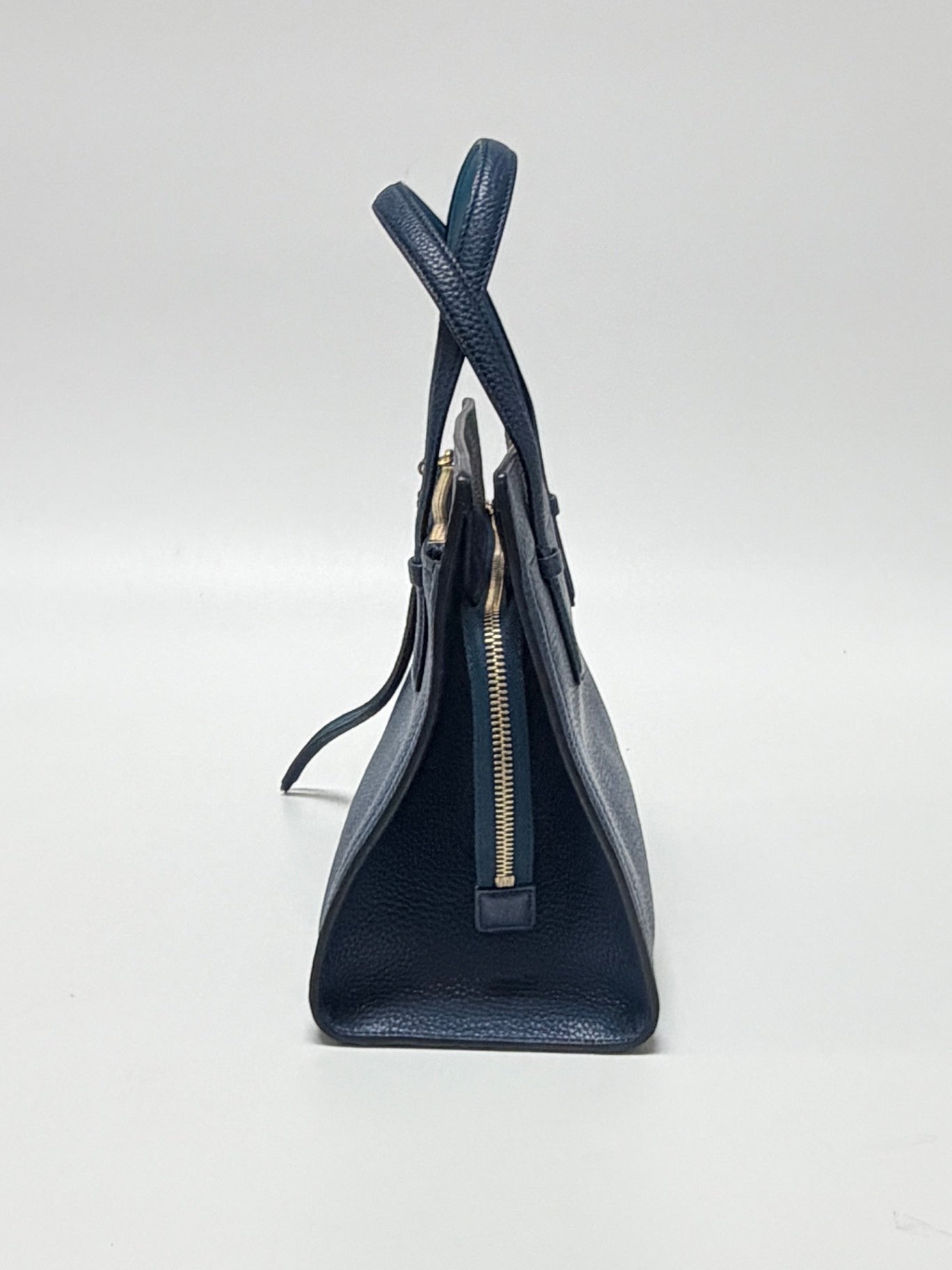 Lynn's Closet Boutique Salvatore Ferragamo Amy small blue pebbled leather tote bag, side view with gold zipper detail.
