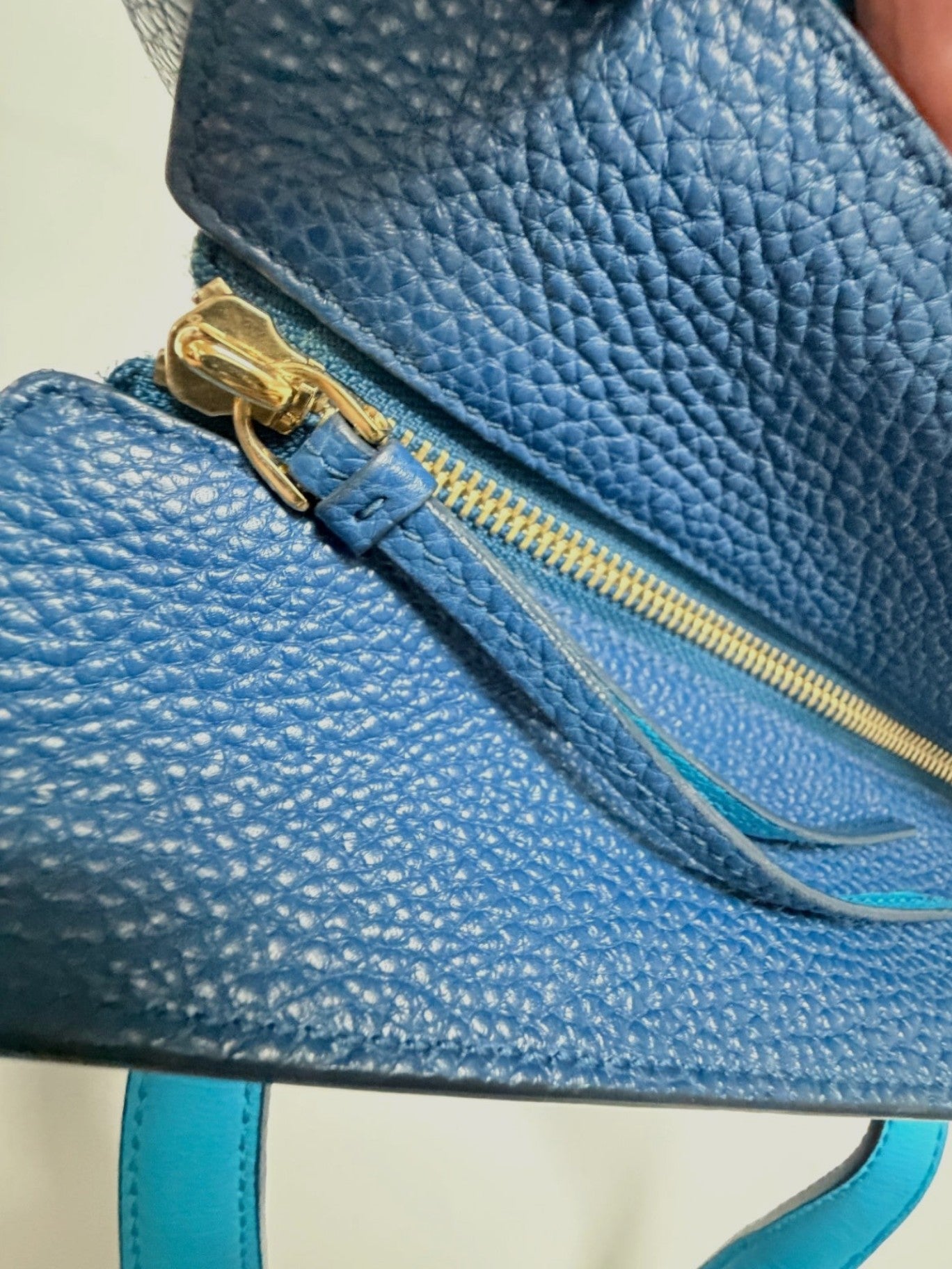 Lynn's Closet Boutique Salvatore Ferragamo Amy blue pebbled leather tote bag featuring gold-tone zipper detail