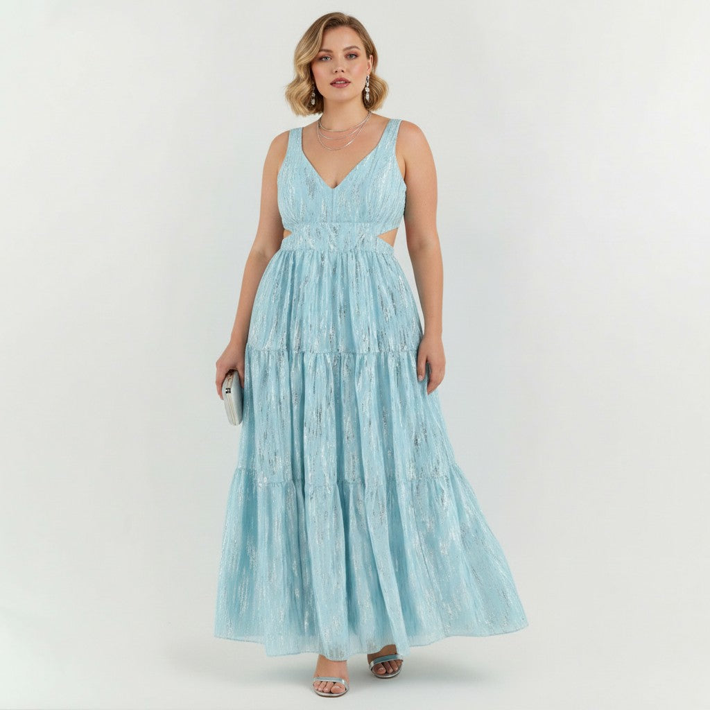 Lynn's Closet Boutique Adian Mattox blue metallic maxi dress with side cutouts and tiered skirt on a model