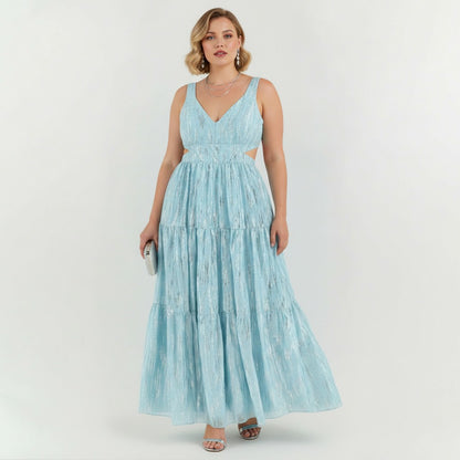 Lynn's Closet Boutique Adian Mattox blue metallic maxi dress with side cutouts and tiered skirt on a model