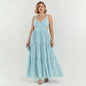 Lynn's Closet Boutique Adian Mattox blue metallic maxi dress with side cutouts and tiered skirt on a model
