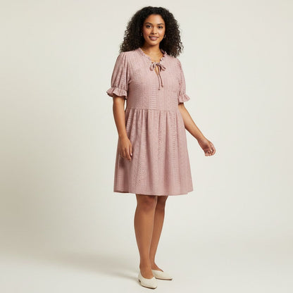 Lynn's Closet Boutique blush pink eyelet dress with ruffle neckline, tie front, and puffed sleeves. Size 2X.
