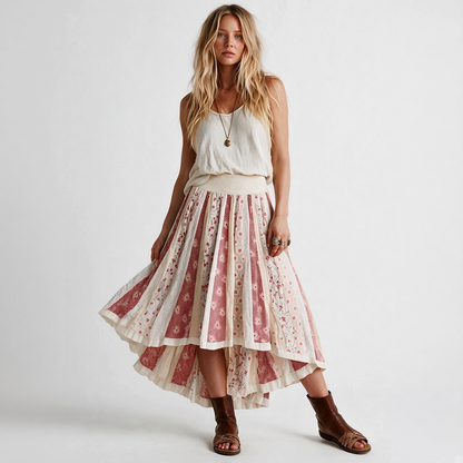 Model wearing a Lynn's Closet Boutique Free People boho high-low skirt with floral patchwork in cream and red tones.