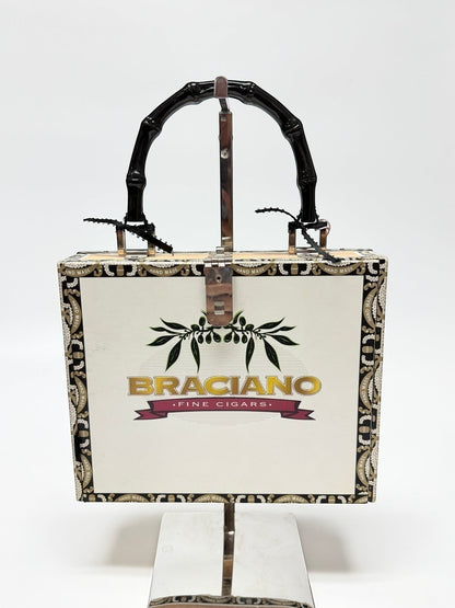 Lynn's Closet Boutique Braciano Vermouth Bianco cigar box purse with black bamboo handle and silver hardware.