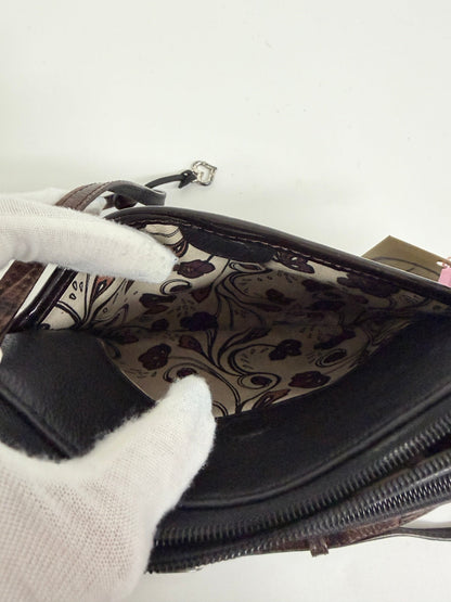 Lynn's Closet Boutique Brighton crossbody bag interior showing the patterned fabric lining and zippered compartments.
