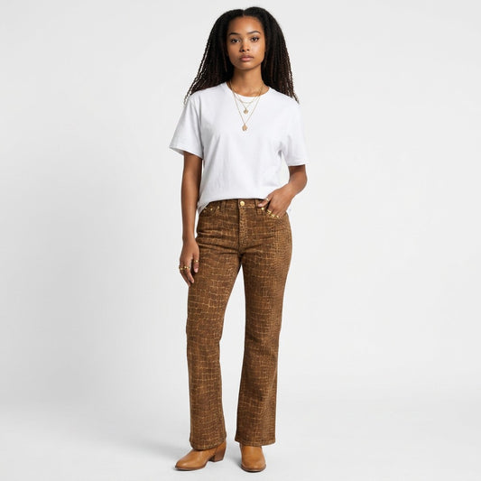 Model wearing Lynn's Closet Boutique Cappopera jeans with brown croc-embossed texture and a white t-shirt