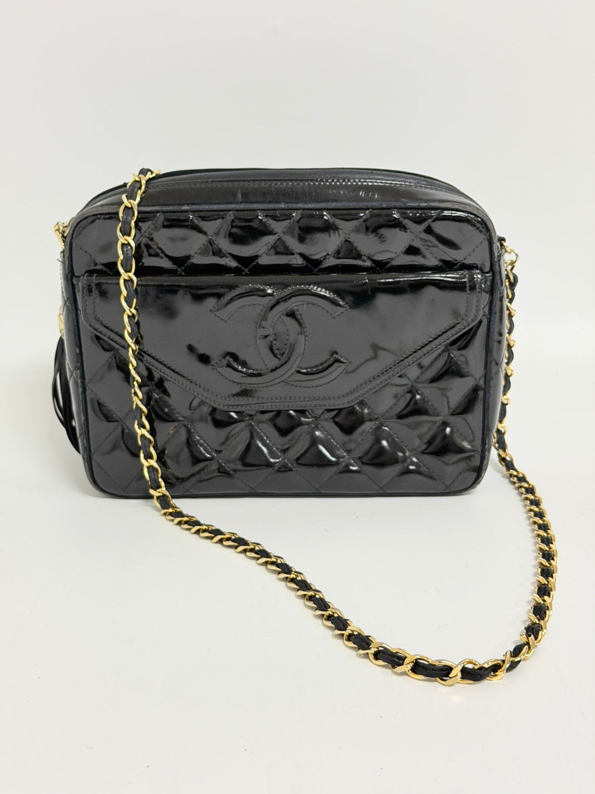 Lynn's Closet Boutique vintage black quilted patent leather Chanel camera bag with gold chain strap and CC logo