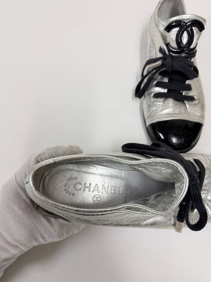 Lynn's Closet Boutique Chanel metallic silver lambskin sneakers with black patent cap toe and CC logo detail