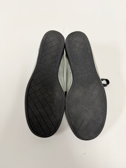 Lynn's Closet Boutique Chanel sneakers showing the black rubber soles with embossed CC logo and diamond pattern