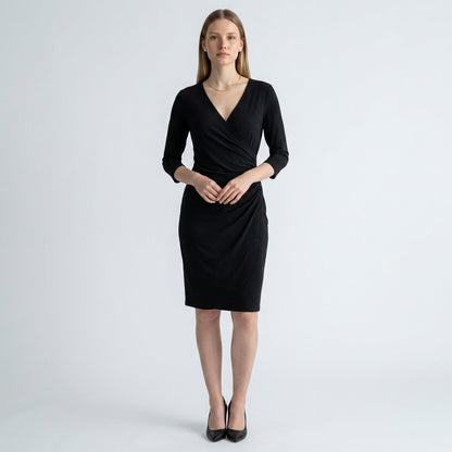 Lynn's Closet Boutique Chicos Travelers black faux wrap dress with three-quarter sleeves on a model