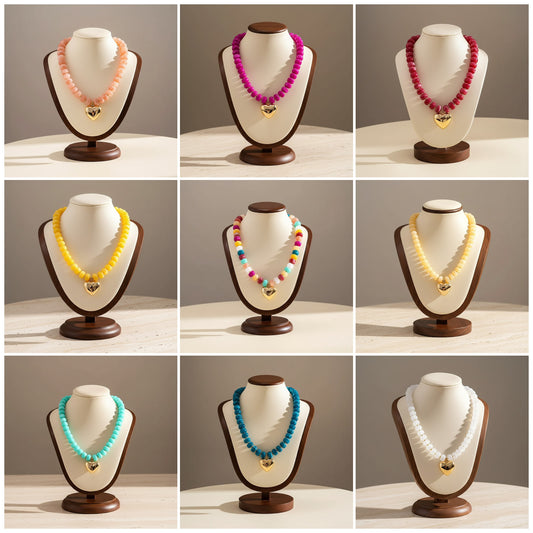 Lynn's Closet Boutique chunky acrylic bead necklaces with gold heart pendants in various vibrant dopamine colors