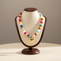 Lynn's Closet Boutique chunky acrylic bead necklace with a gold-tone heart pendant on a display bust