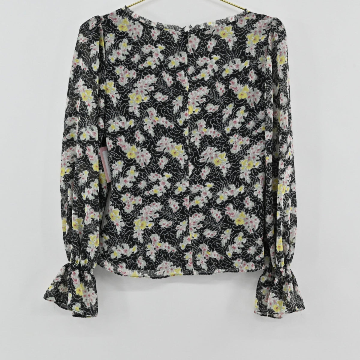 Lynn's Closet Boutique Cinq a Sept floral top in black with yellow and pink flowers, long sleeves and ruffle cuffs