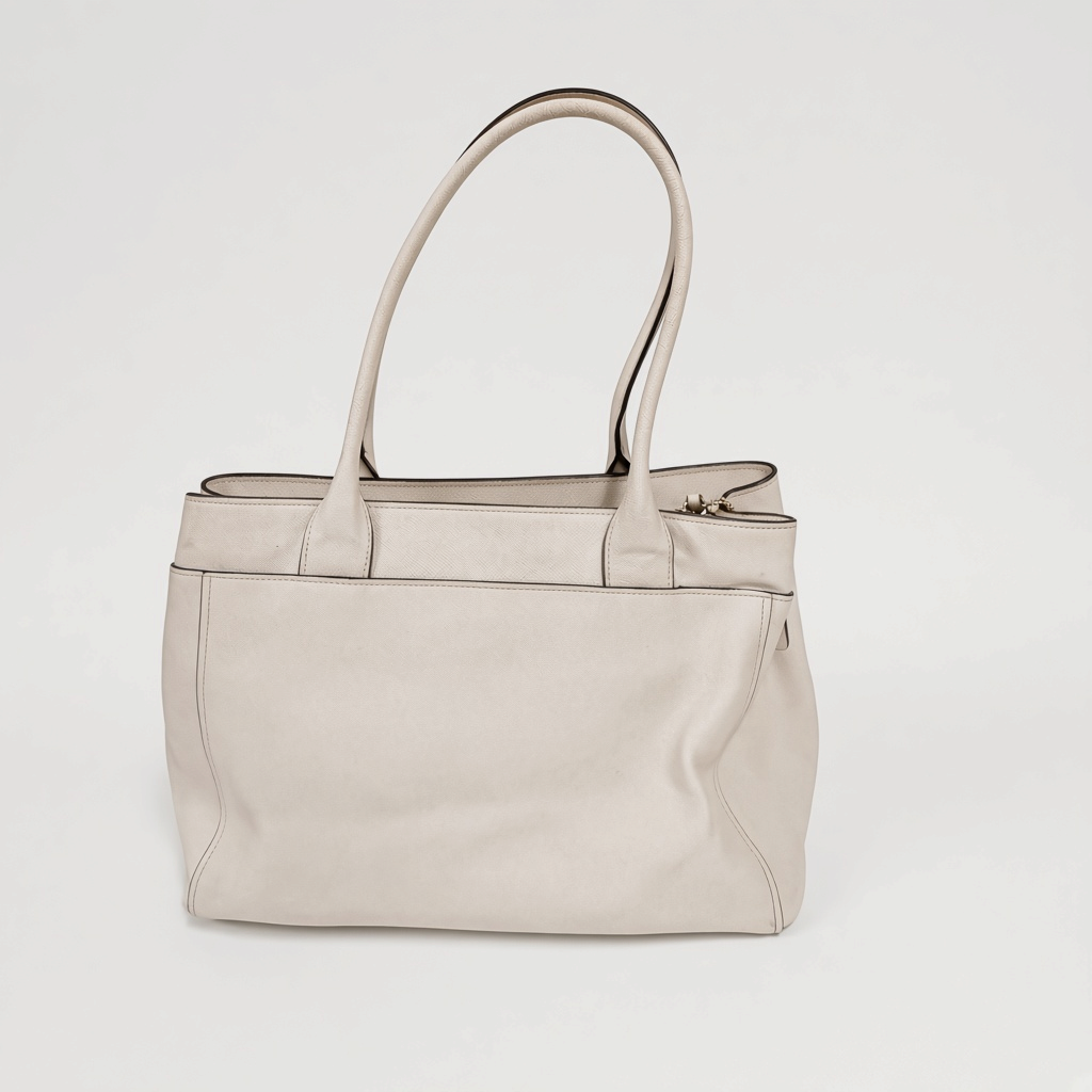 Lynn's Closet Boutique Coach Casey tote bag in chalk crossgrain leather with shoulder straps and structured design.