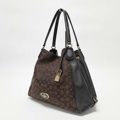 Lynn's Closet Boutique Coach Edie shoulder bag in brown signature jacquard with black leather trim and gold hardware.