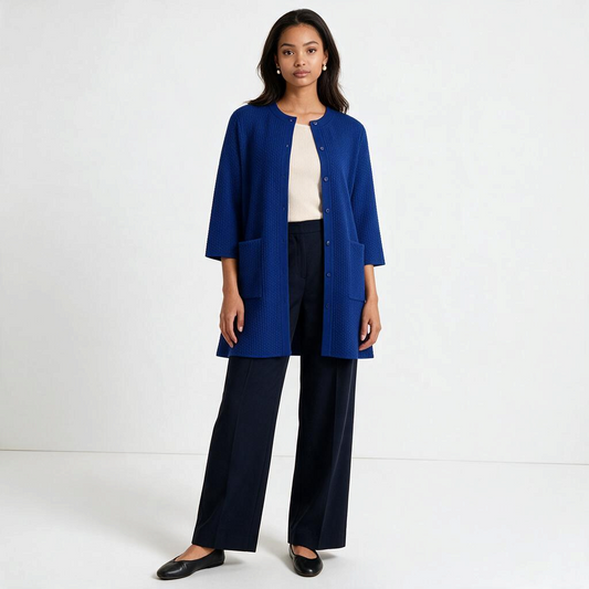 Model wearing a Lynn's Closet Boutique cobalt blue textured knit cardigan with patch pockets and a button-front closure.