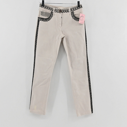 Lynn's Closet Boutique cream pants with intricate black embroidery on the waistband, pockets, and side seams.