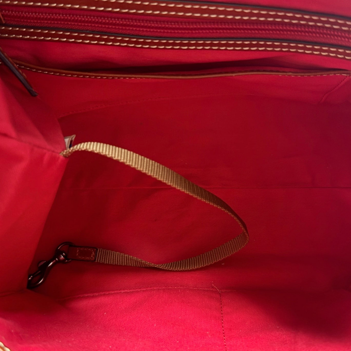 Lynn's Closet Boutique Dooney & Bourke tote interior featuring vibrant red fabric lining and a secure key hook.