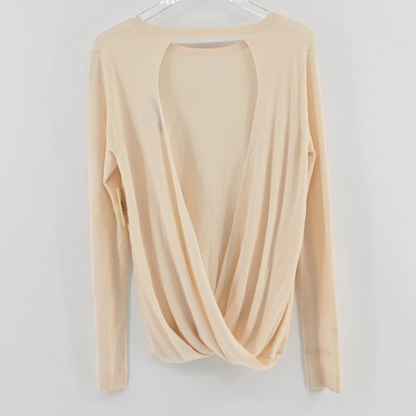 Lynn's Closet Boutique DVF Kylee cream long-sleeve sweater featuring a dramatic open-back design with a twisted hem.