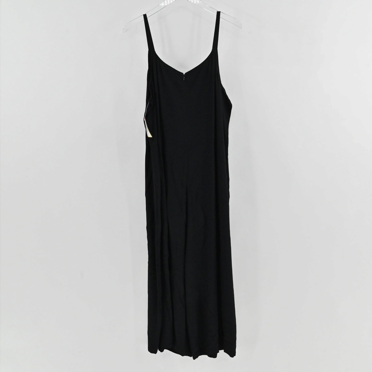 Lynn's Closet Boutique Eileen Fisher black sleeveless jumpsuit with V-neckline and spaghetti straps on a hanger