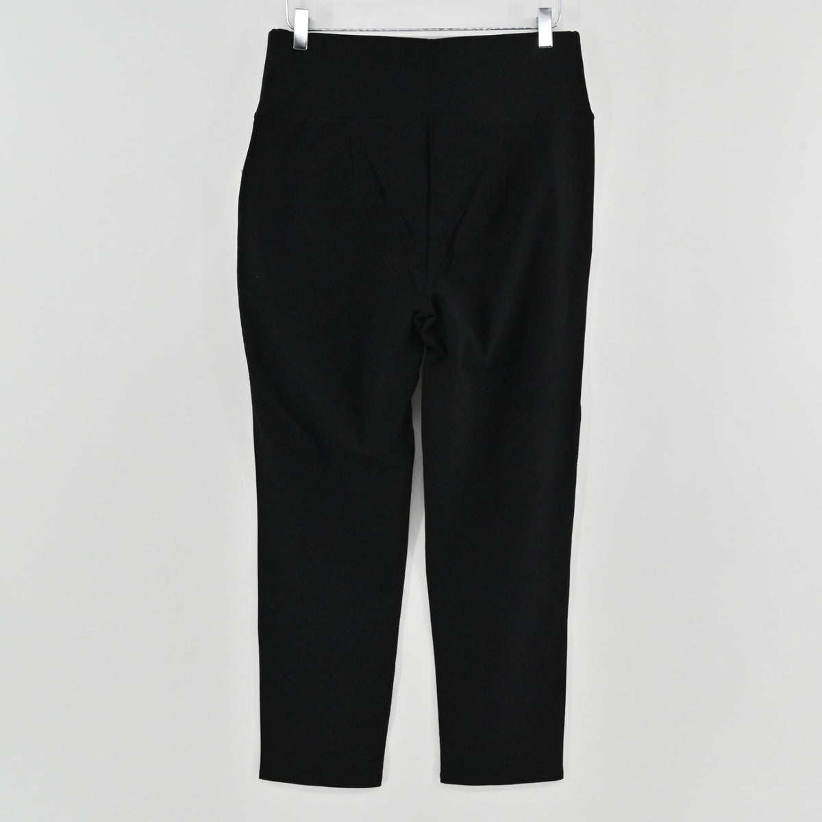 Lynn's Closet Boutique Eileen Fisher black high-waist slim-fit pants hanging against a plain white background.