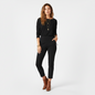 Model wearing Lynn's Closet Boutique Eileen Fisher black high-waist slim-fit pants with a long-sleeve top and boots.