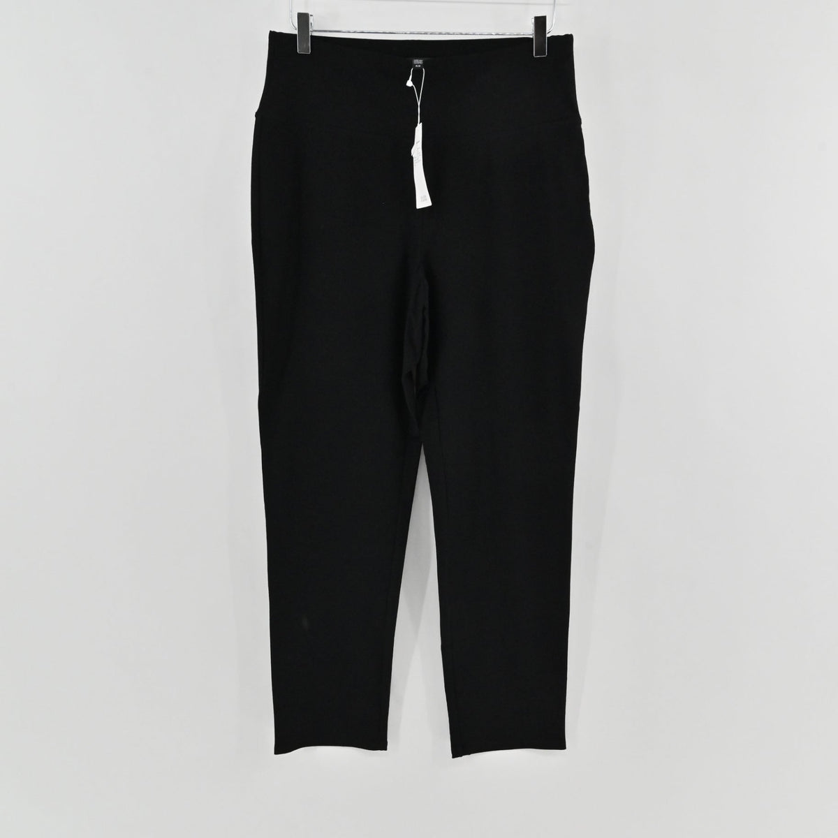 Lynn's Closet Boutique Eileen Fisher black high-waist slim-fit trousers with original tags hanging on a hanger.