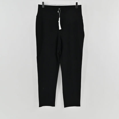 Lynn's Closet Boutique Eileen Fisher black high-waist slim-fit trousers with original tags hanging on a hanger.