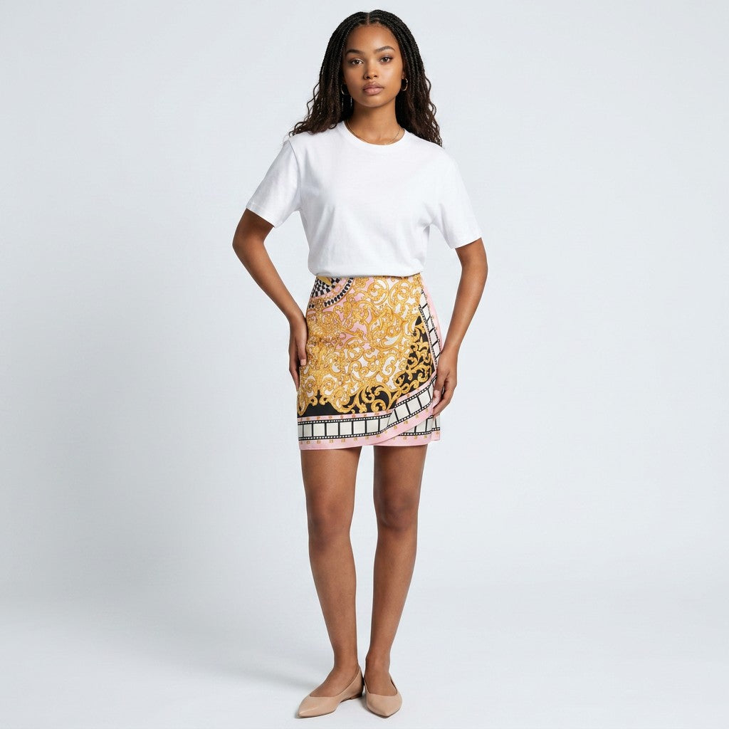 Model wearing a Lynn's Closet Boutique vintage Emanuel Ungaro baroque print mini skirt with a white t-shirt.