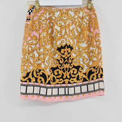 Lynn's Closet Boutique vintage Emanuel Ungaro skirt with pink, gold, and black baroque print and film-strip hem.