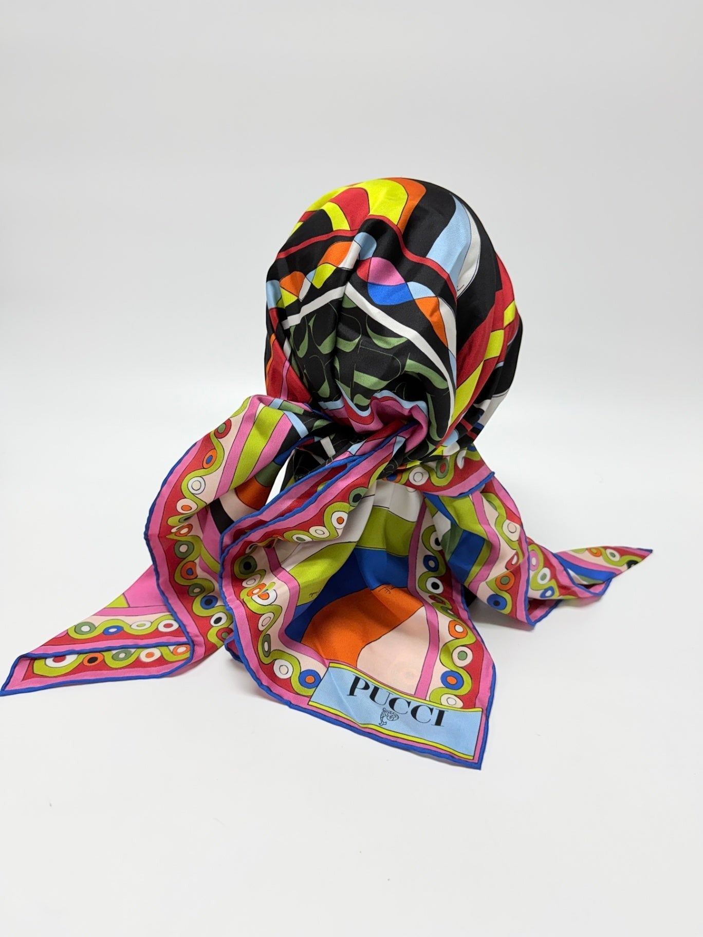 Lynn's Closet Boutique Emilio Pucci silk twill hat with a vibrant kaleidoscopic print in black, pink, blue, and yellow.