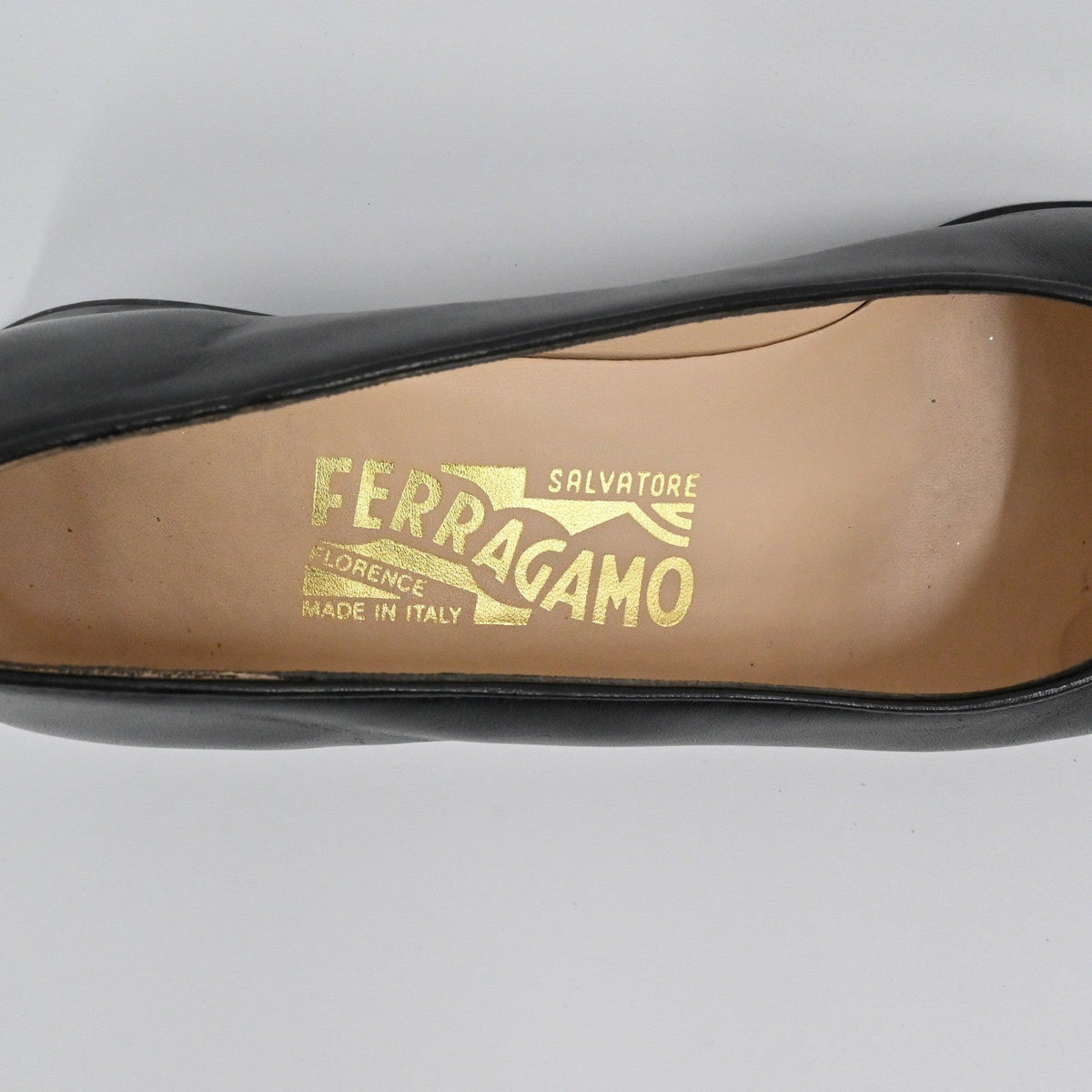 Lynn's Closet Boutique Salvatore Ferragamo black leather pump interior with gold logo branding on the insole
