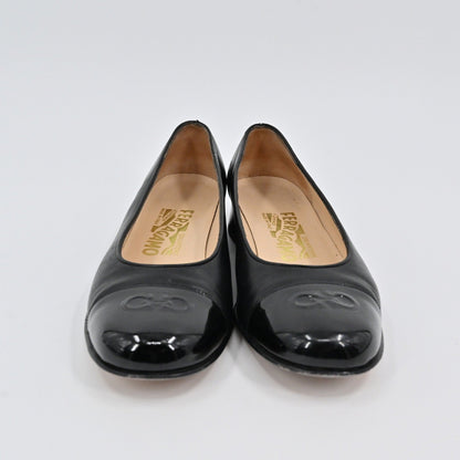 Lynn's Closet Boutique black leather Salvatore Ferragamo pumps with patent cap toe and embossed Gancini logo