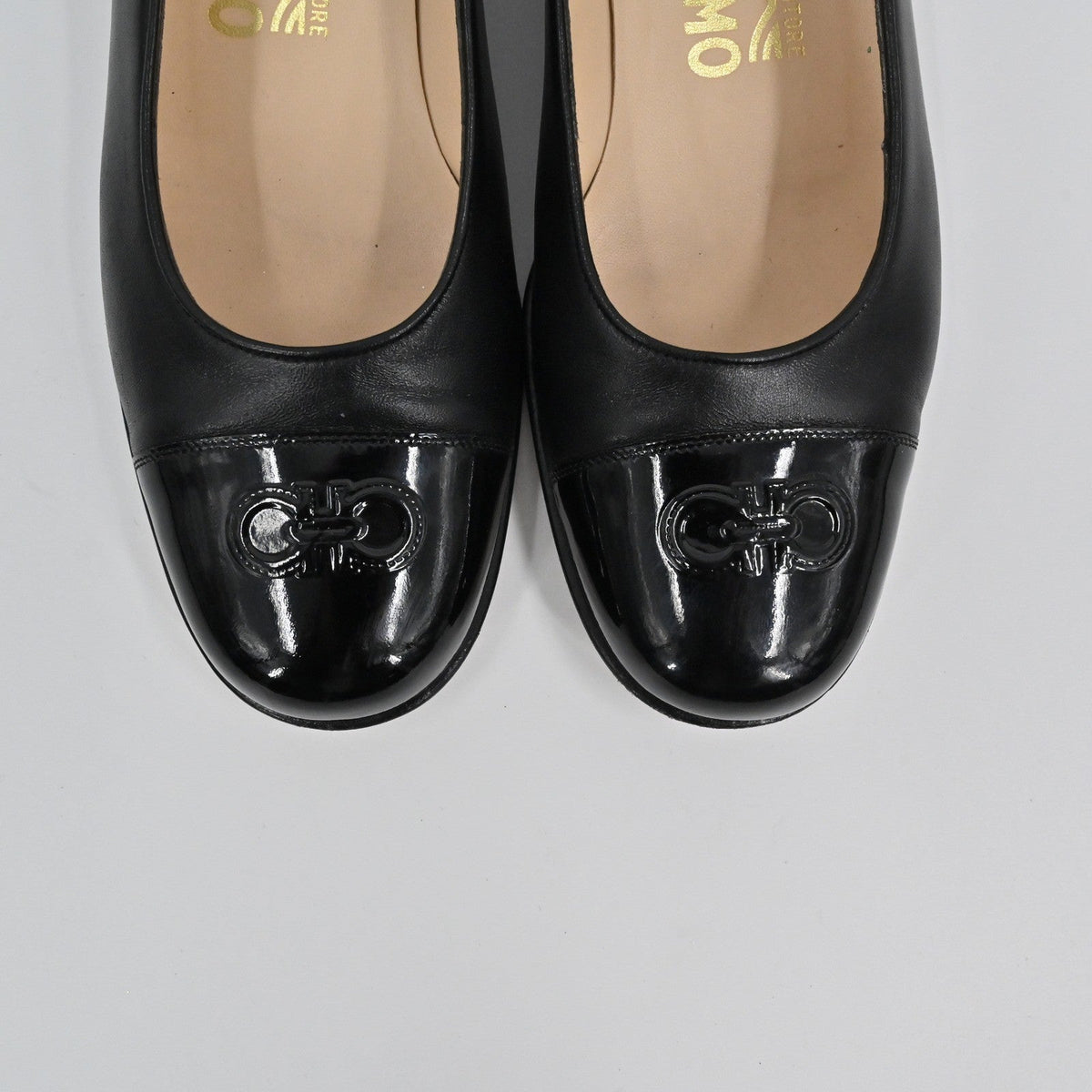 Lynn's Closet Boutique Salvatore Ferragamo black leather pumps with patent cap toe and iconic Gancini logo detail