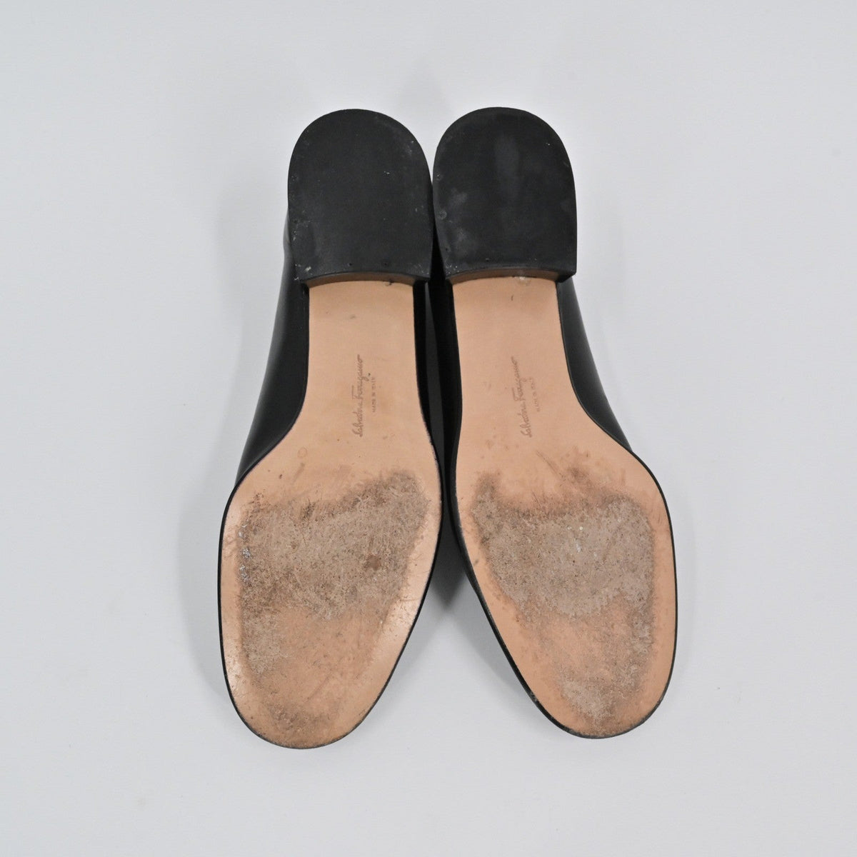 Lynn's Closet Boutique Salvatore Ferragamo black leather pumps showing the worn soles and low block heels