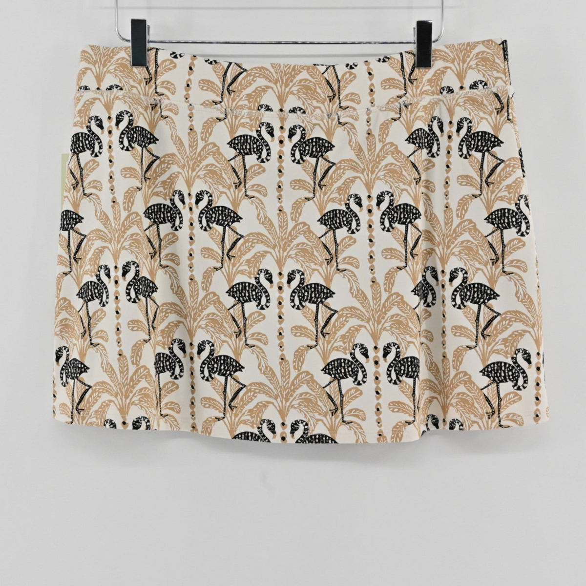 Lynn's Closet Boutique athletic skort in a beige and black flamingo and palm tree print with built-in undershorts.