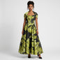 Model wearing a Lynn's Closet Boutique strapless black and lime green floral A-line gown with a matching bolero jacket.