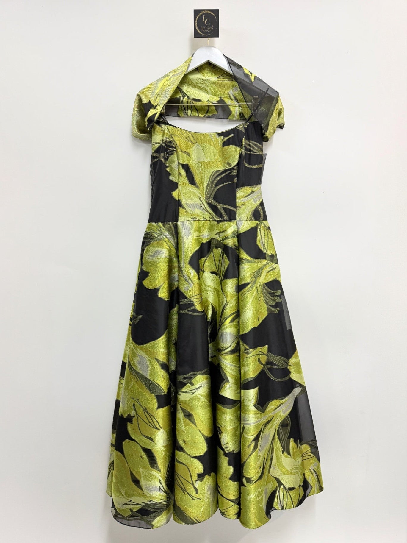 Lynn's Closet Boutique strapless A-line formal gown in black with vibrant lime green floral print and matching wrap.