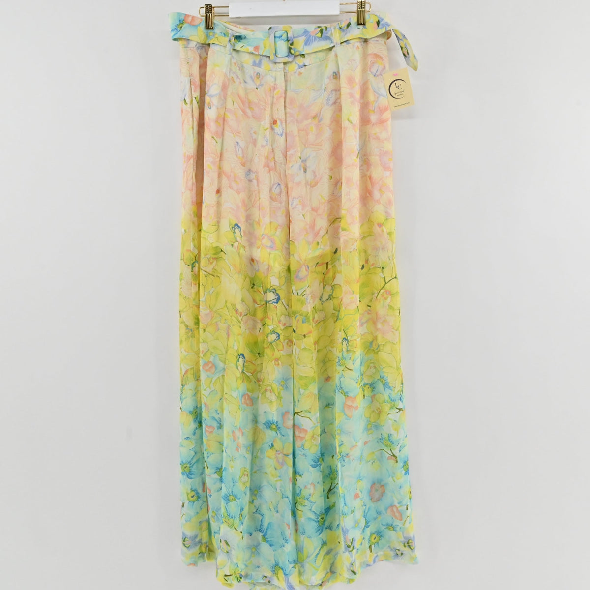 Lynn's Closet Boutique Là Fuori wide-leg pleated pants featuring a watercolor floral print in peach, yellow, and blue.