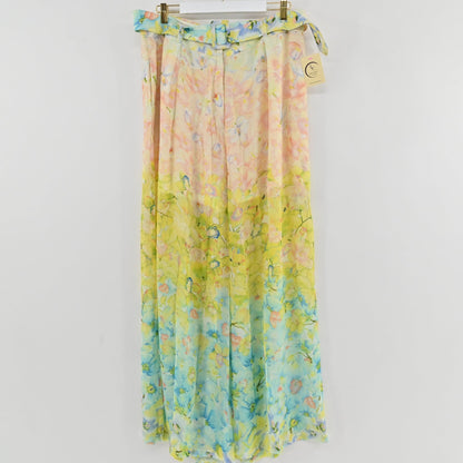 Lynn's Closet Boutique Là Fuori wide-leg pleated pants featuring a watercolor floral print in peach, yellow, and blue.