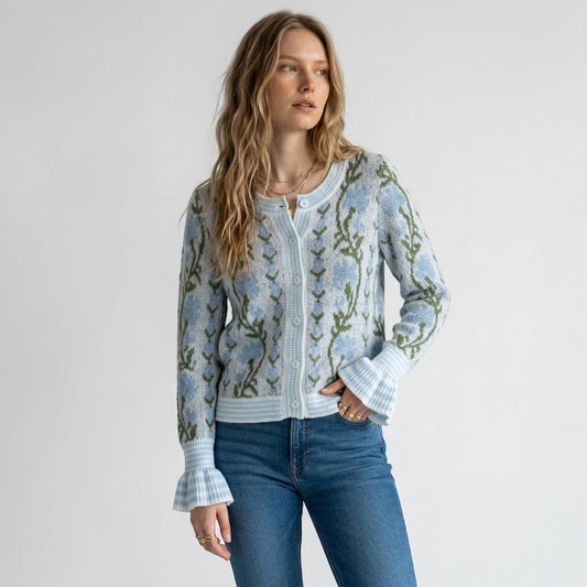 Lynn's Closet Boutique So Me floral wool cardigan with blue and green pattern and flared cuffs worn by a model.