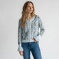 Lynn's Closet Boutique So Me floral wool cardigan with blue and green pattern and flared cuffs worn by a model.