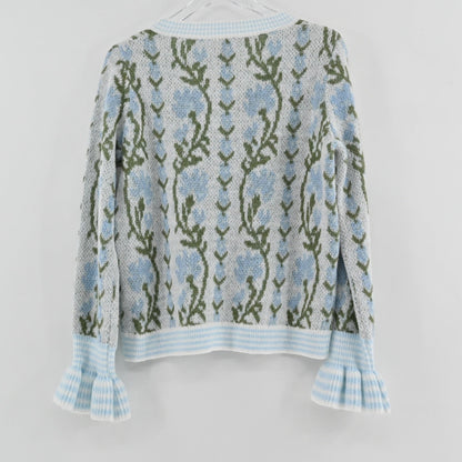 Lynn's Closet Boutique So Me floral wool cardigan featuring blue flowers, green stems, and ruffled cuffs, back view.