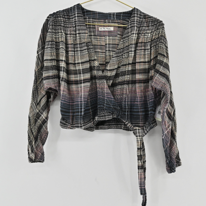 Lynn's Closet Boutique Free People plaid cropped wrap top with long sleeves and shirred shoulders in a gradient wash.