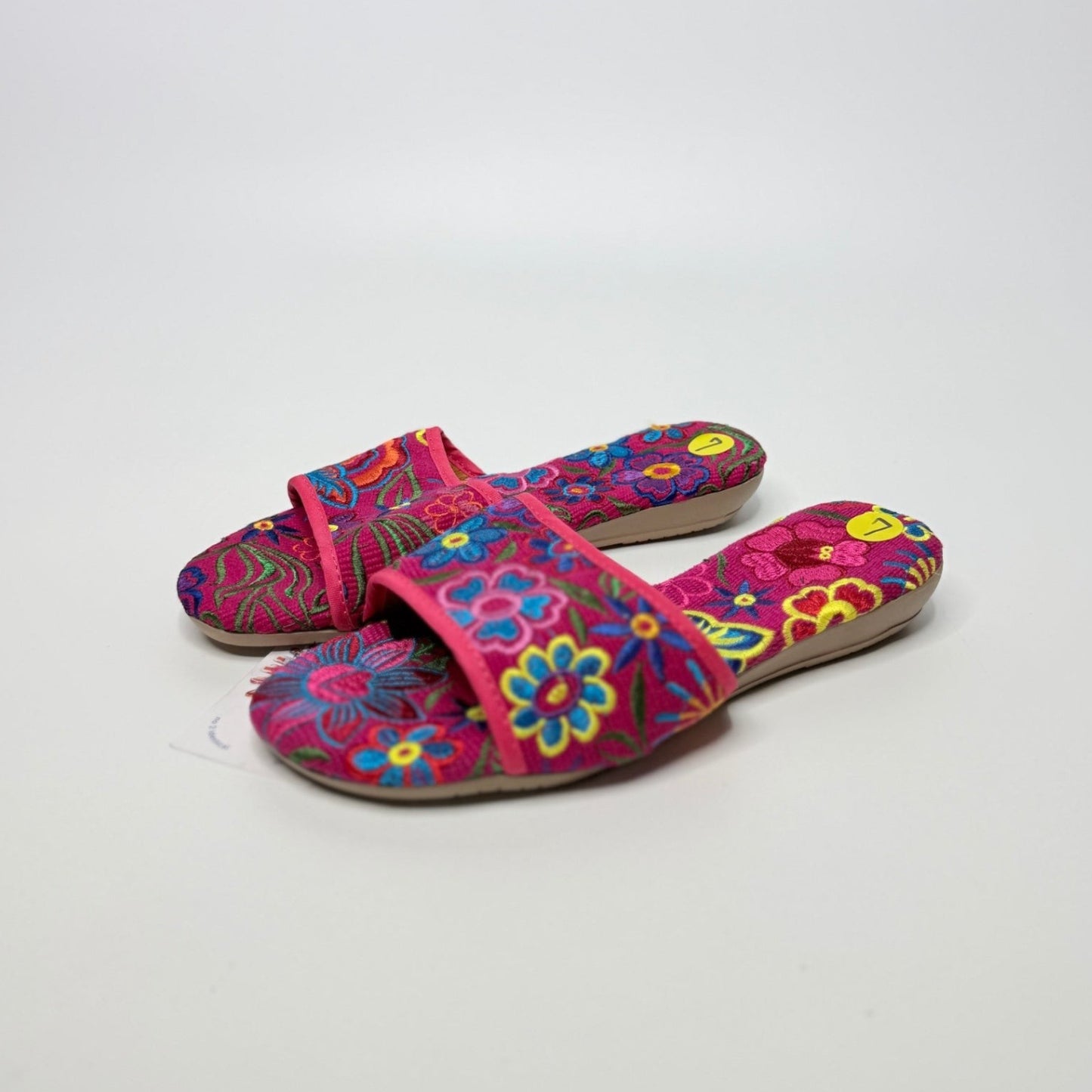 Lynn's Closet Boutique fuchsia fabric slides featuring vibrant multi-colored floral embroidery and cushioned footbeds.