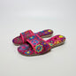 Lynn's Closet Boutique fuchsia fabric slides featuring vibrant multi-colored floral embroidery and cushioned footbeds.