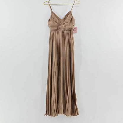 Lynn's Closet Boutique Stacy Fichtman gold pleated maxi dress with spaghetti straps and smocked back, hanging view.