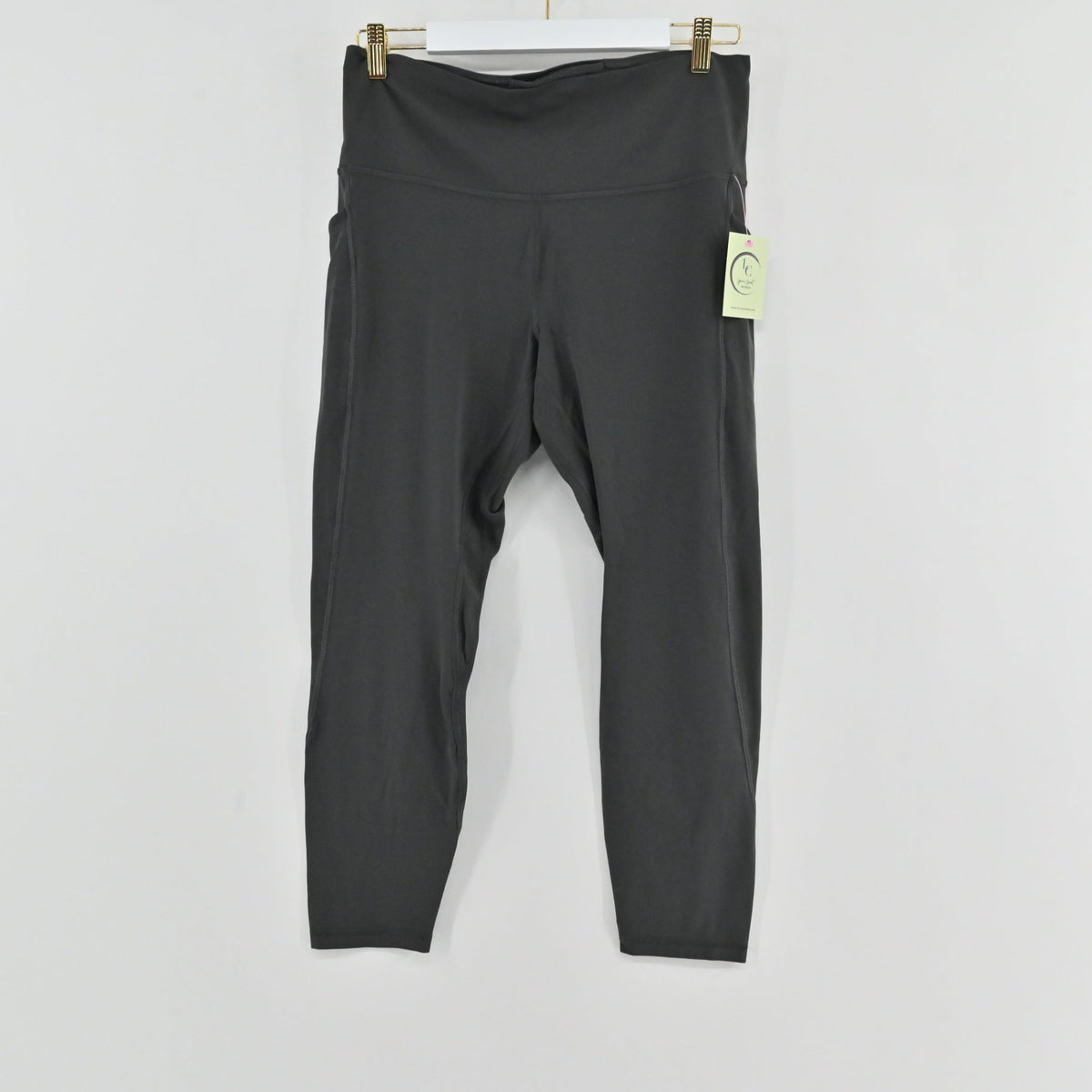 Lynn's Closet Boutique gray Lululemon high-rise Align leggings with side pockets hanging on a white background.