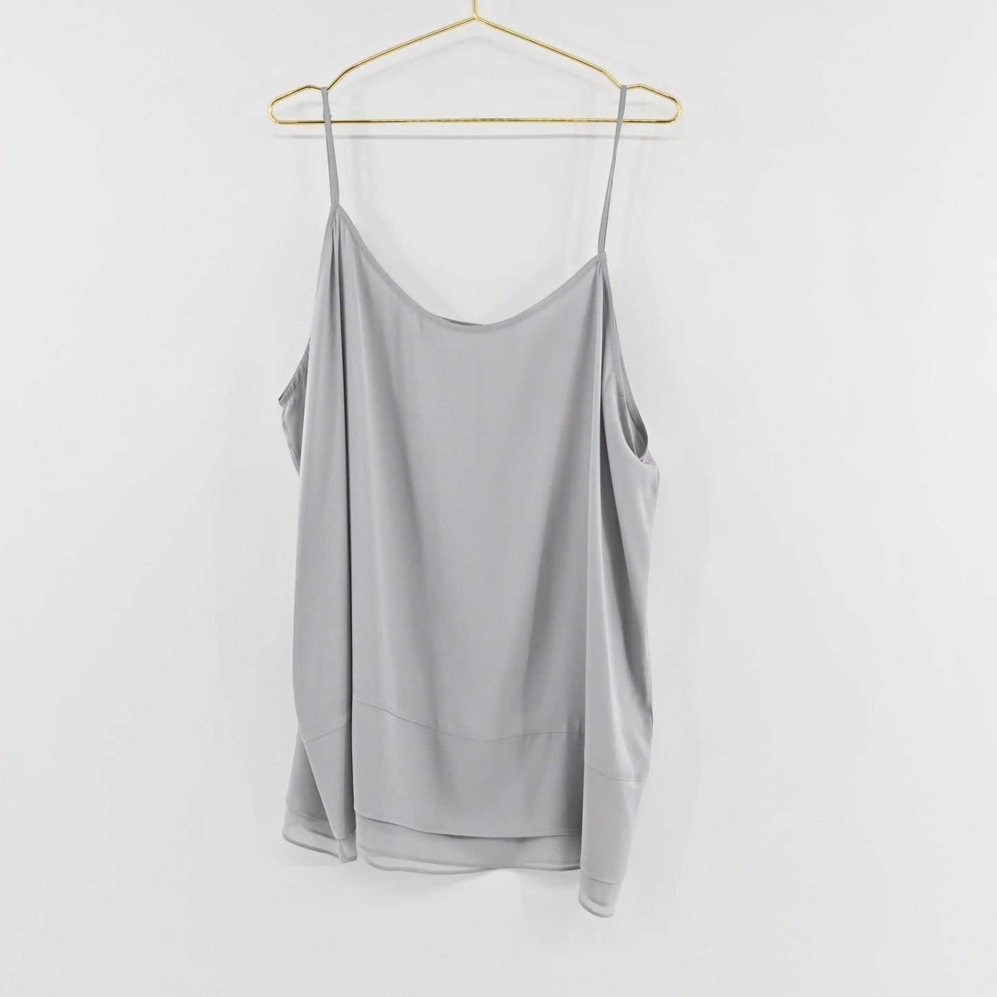 Lynn's Closet Boutique Nouvelle gray silk-blend camisole with adjustable spaghetti straps and layered hem detail.
