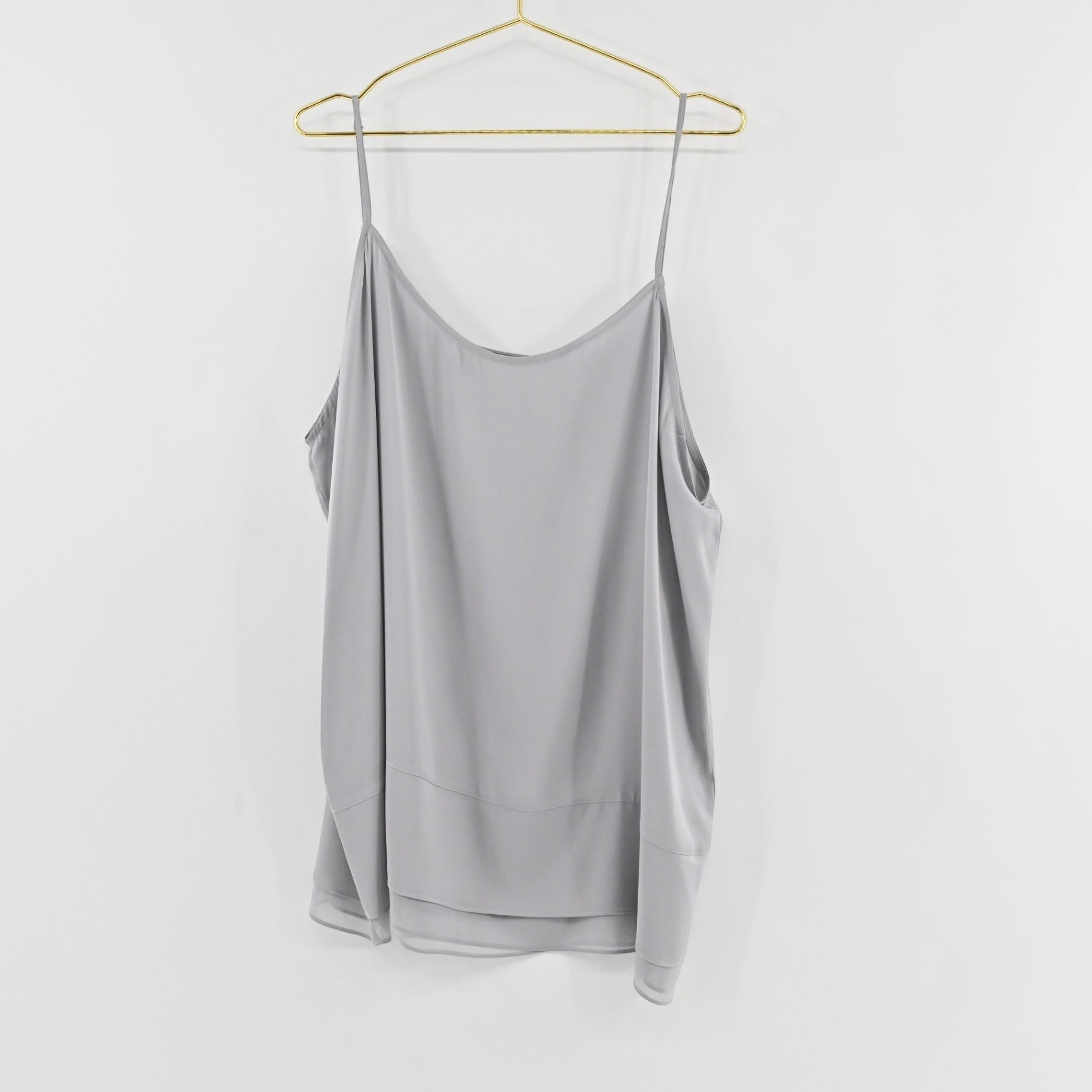Lynn's Closet Boutique Nouvelle gray silk-blend camisole with adjustable spaghetti straps and layered hem detail.